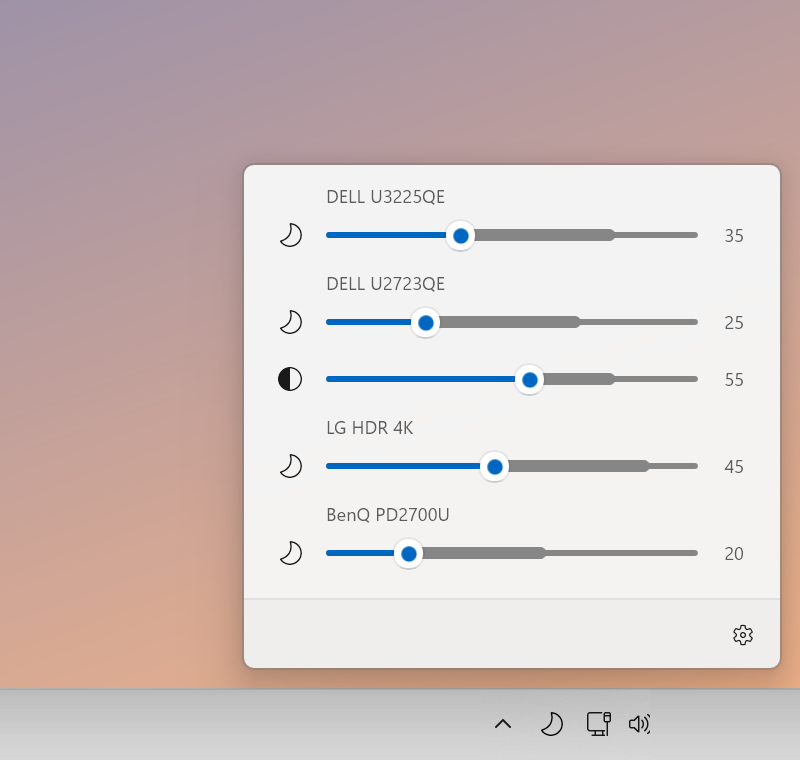 The Astro Dimmer panel at night: four monitors turned down to between 20 and 45 percent, with moon icons.